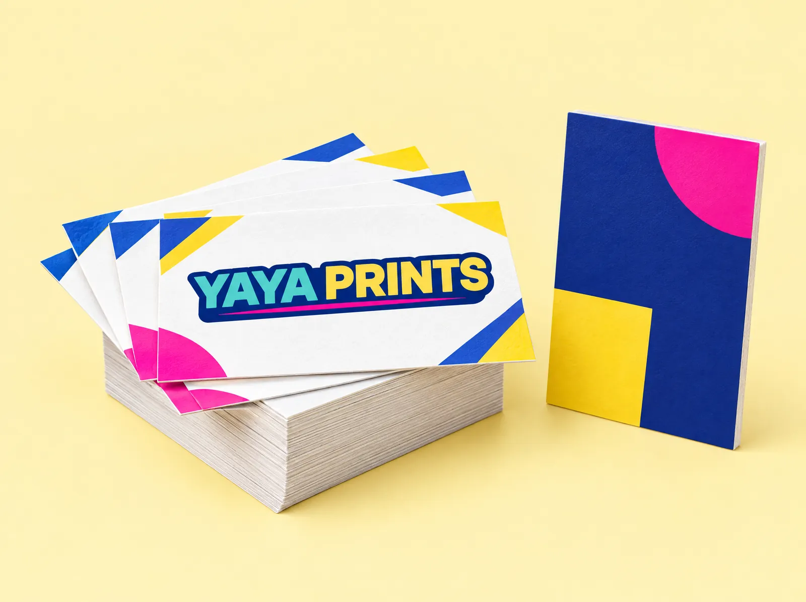 A stack of thick business cards with colourful corners