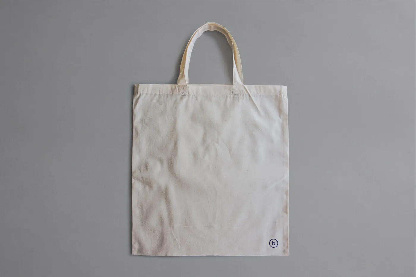 A plain canvas tote bag ready for custom printing