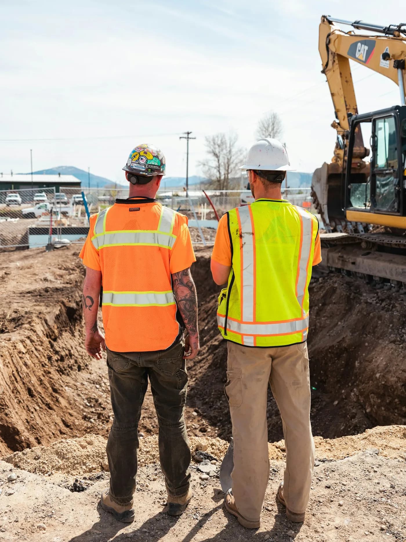 A construction crew in branded hi-vis workwear on an Ottawa job site