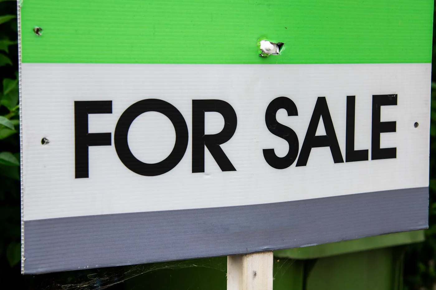 A custom coroplast 'For Sale' lawn sign staked on a green lawn in Ottawa