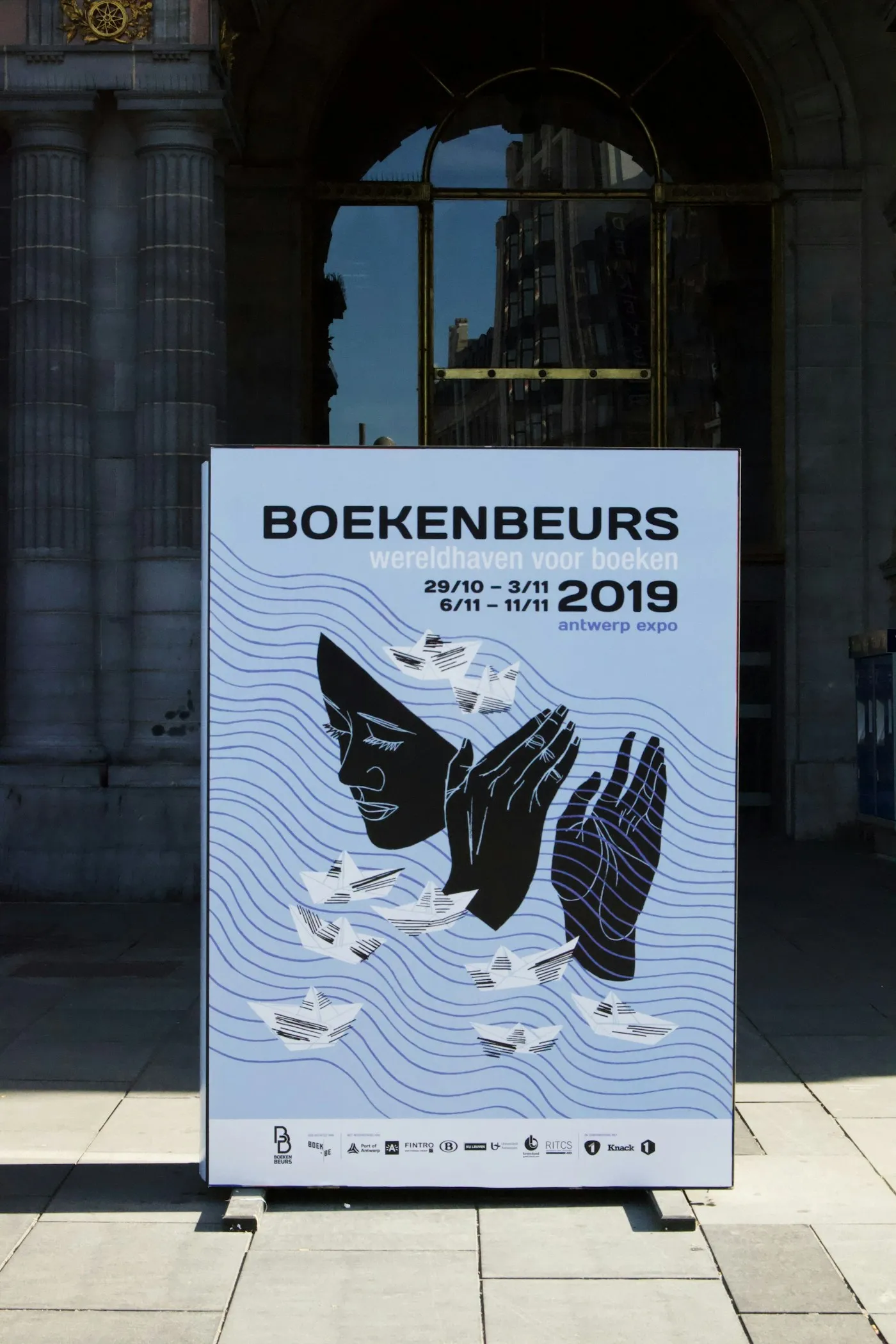A portable pull-up banner stand set up for display