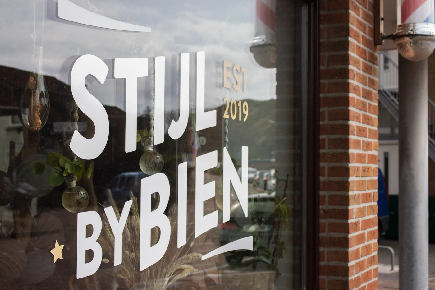 Custom white vinyl lettering on an Ottawa storefront window