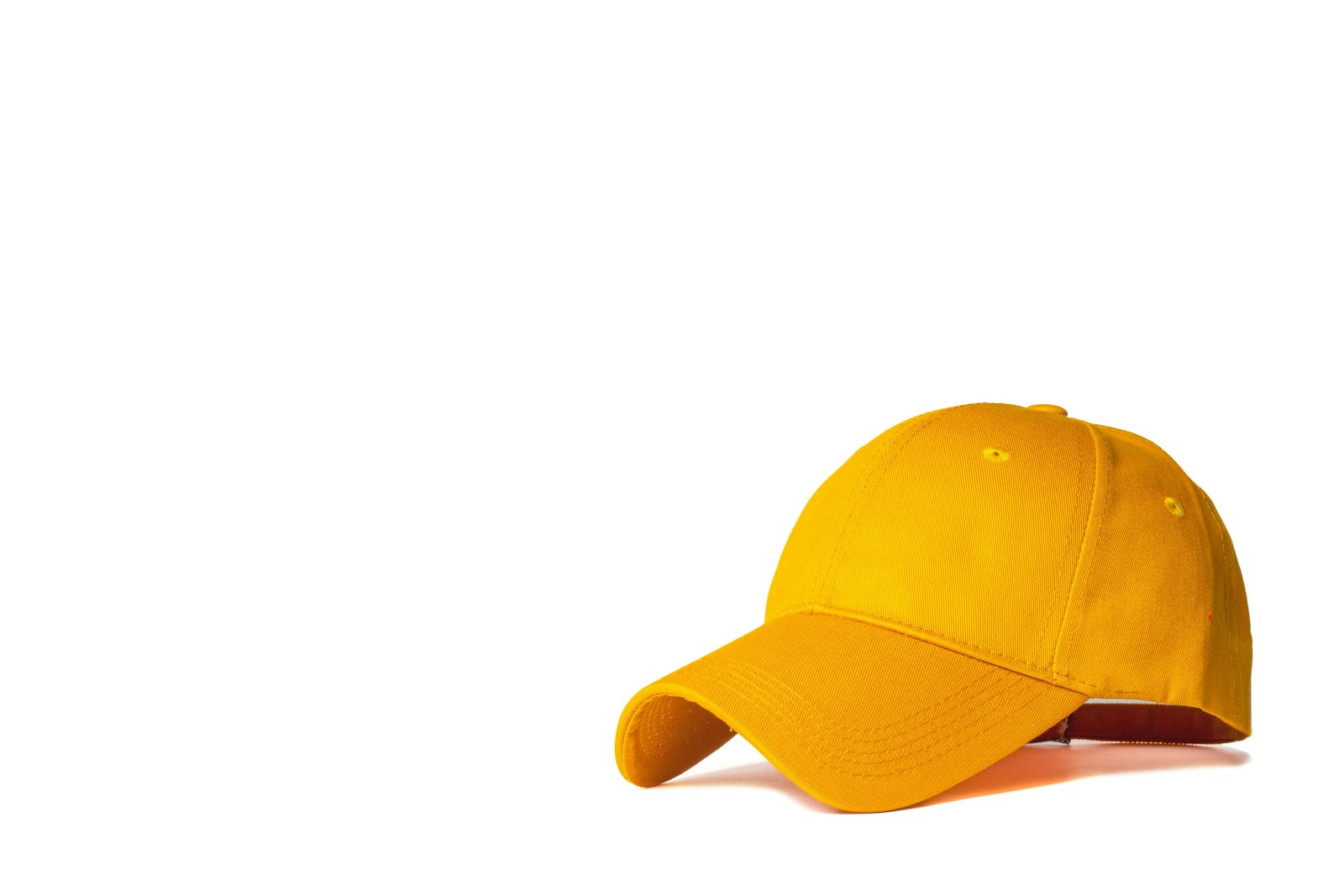 A bright yellow curved-brim cap photographed against a white background