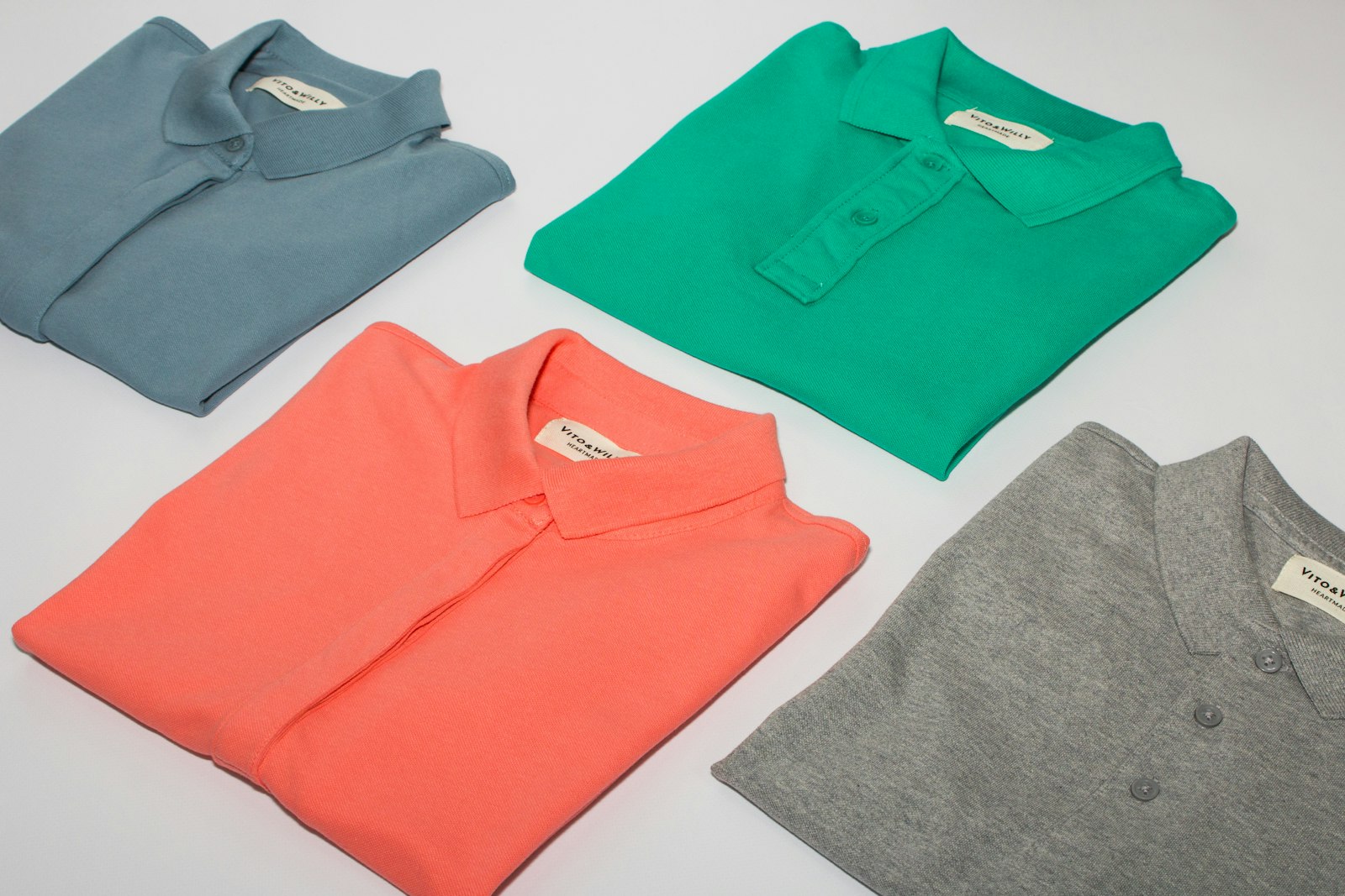 Folded custom polo shirts in several colours