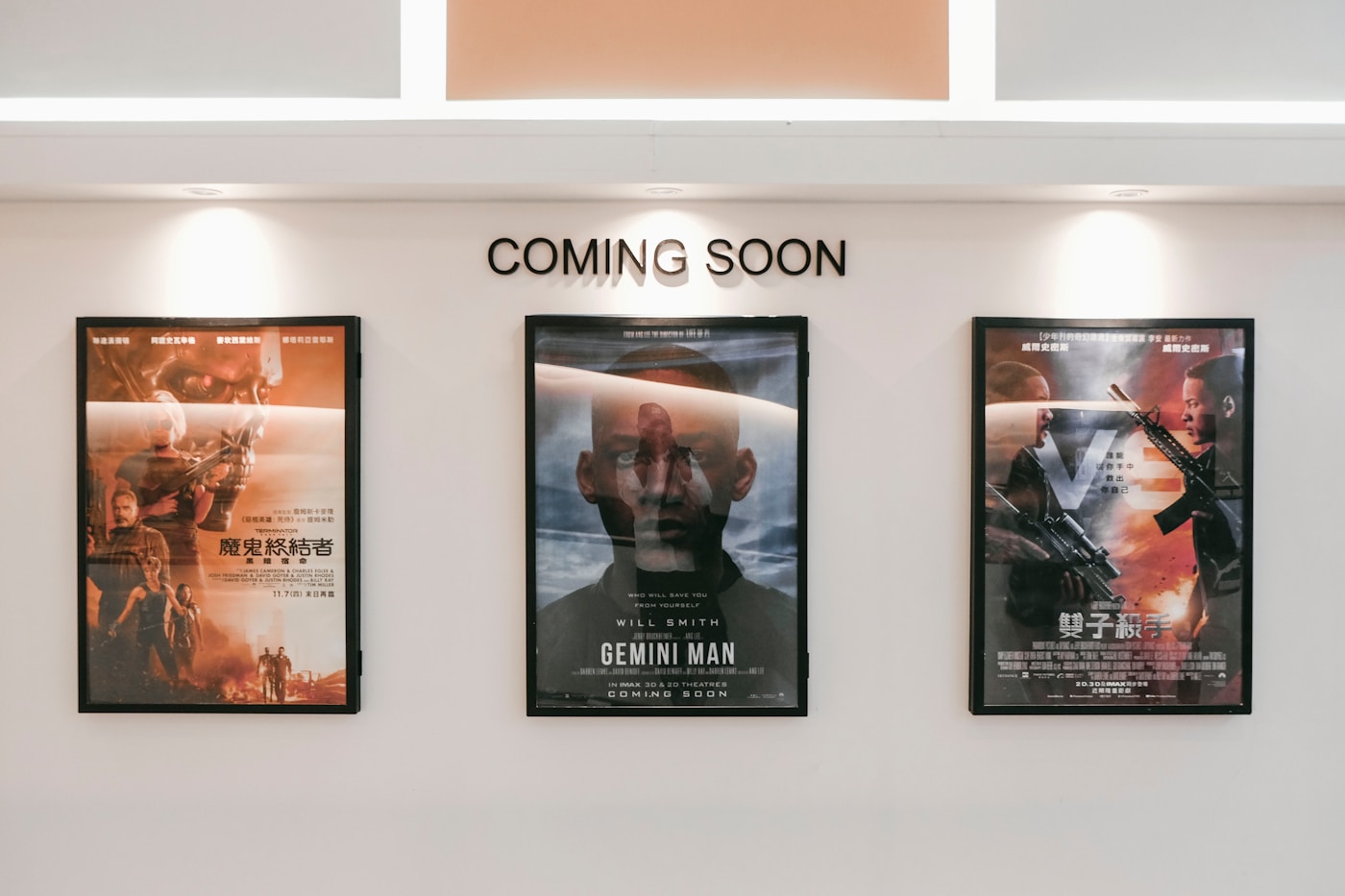 Framed printed posters on a wall