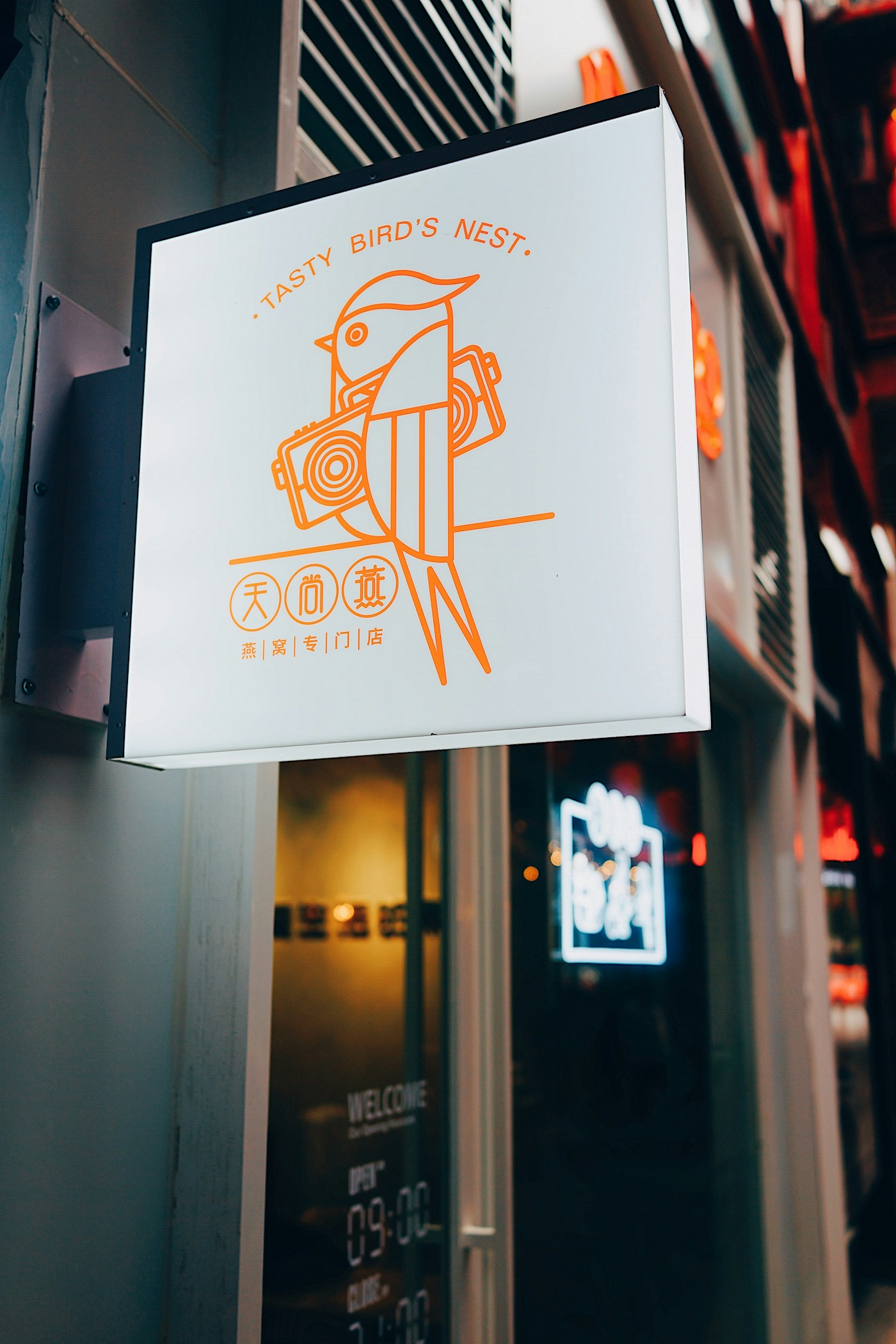 An illuminated projecting storefront sign