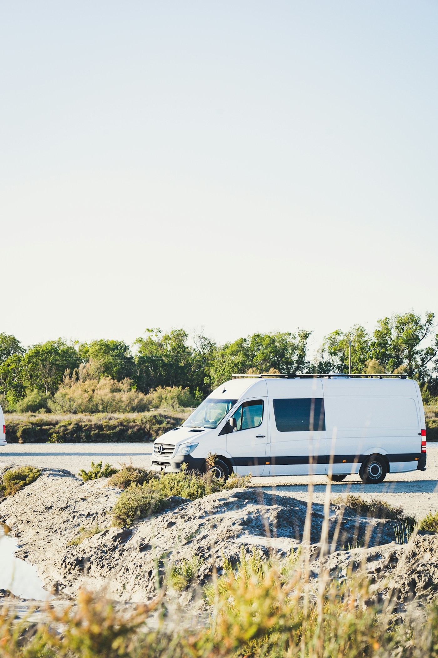A plain white work van, a blank canvas for graphics